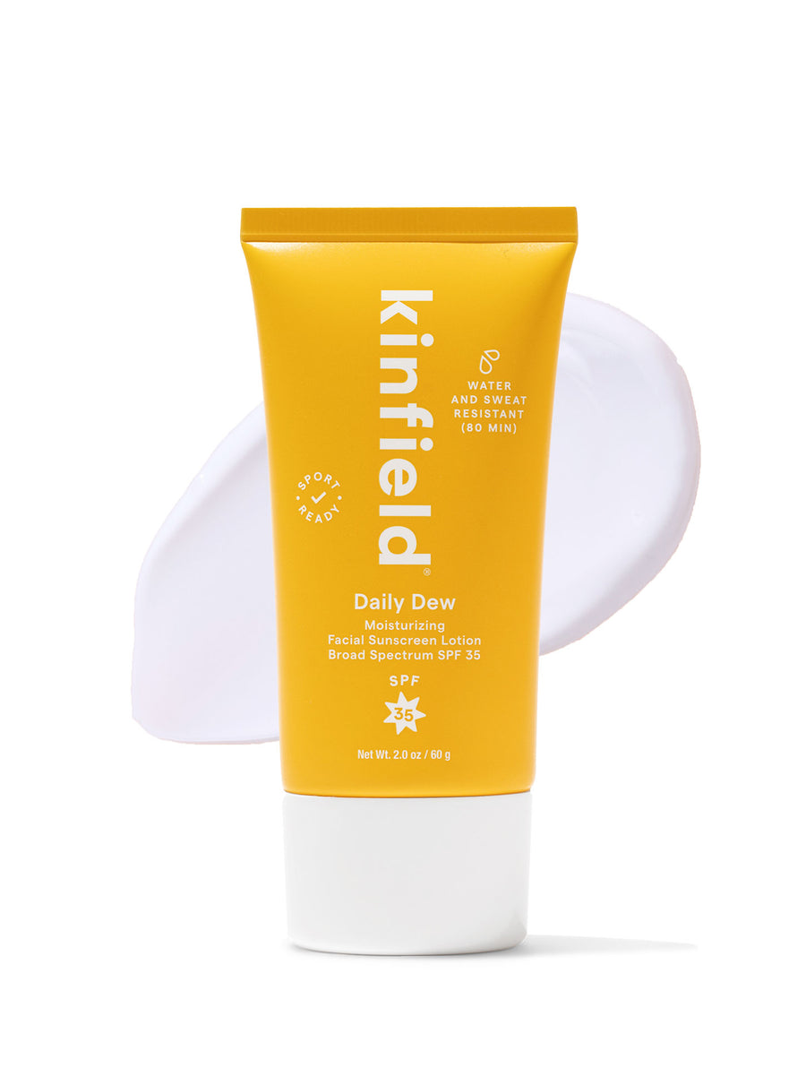 A tube of Kinfield Daily Dew SPF 35 on a white background with a swatch of product.