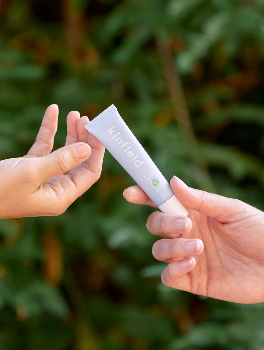 Hands pass Lip Rescue to each other.